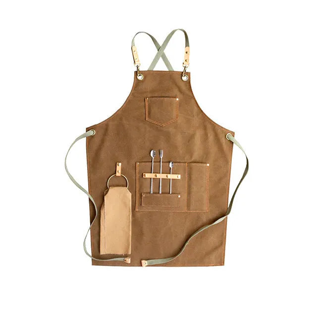 Canvas apron with cross-strap design in camel colour for café work and baking