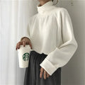 Women's solid colour long sleeve top with a half-high collar in a loose fit.