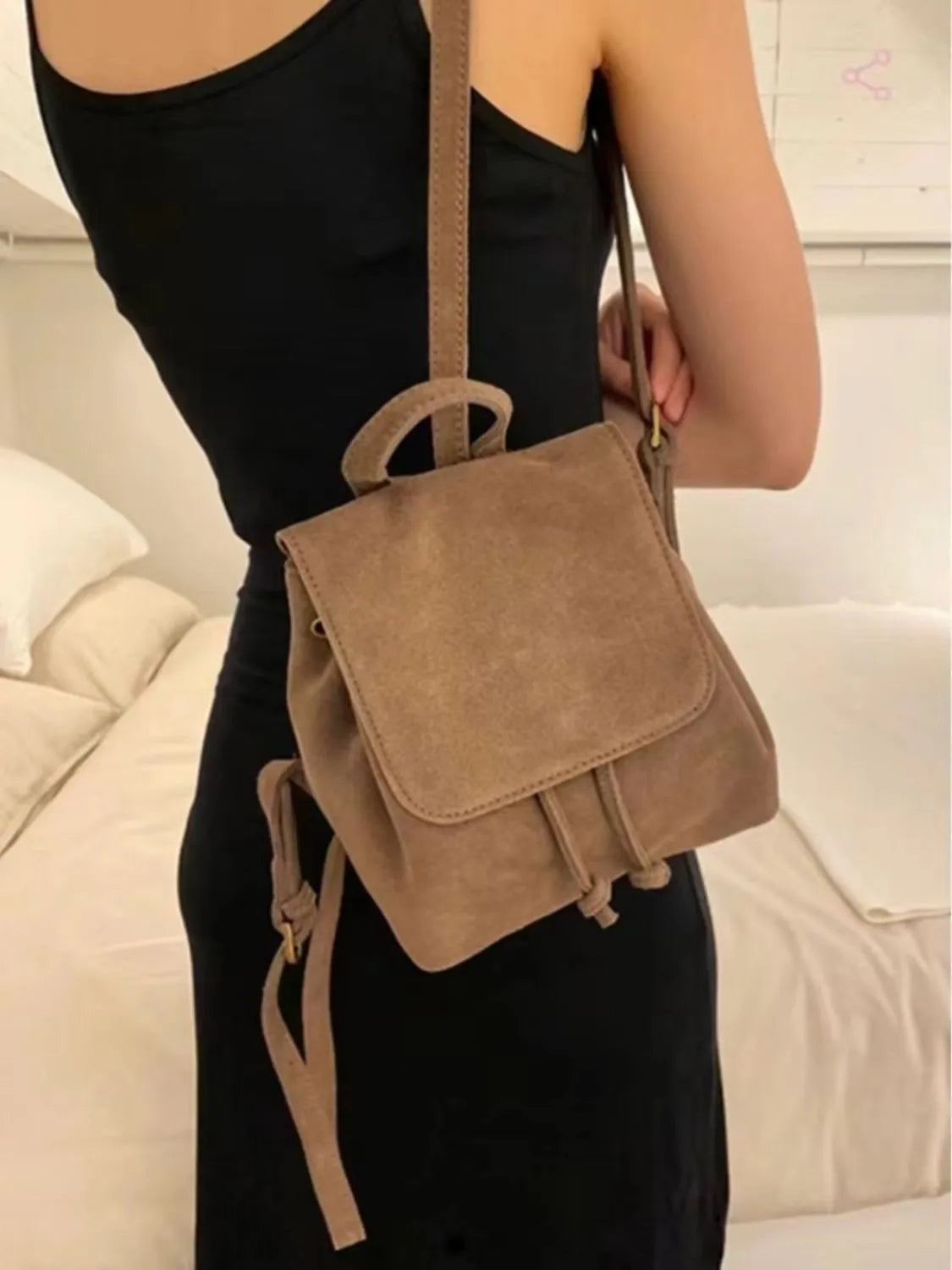 Retro suede girls backpack in brown with shoulder strap and sewing thread detailing