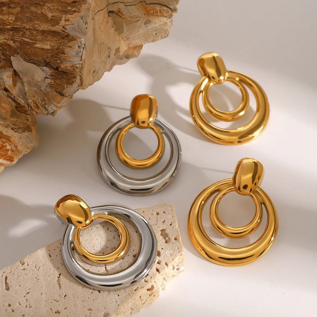 Golden round double-layer hollow stud earrings with 18K gold plating on titanium steel