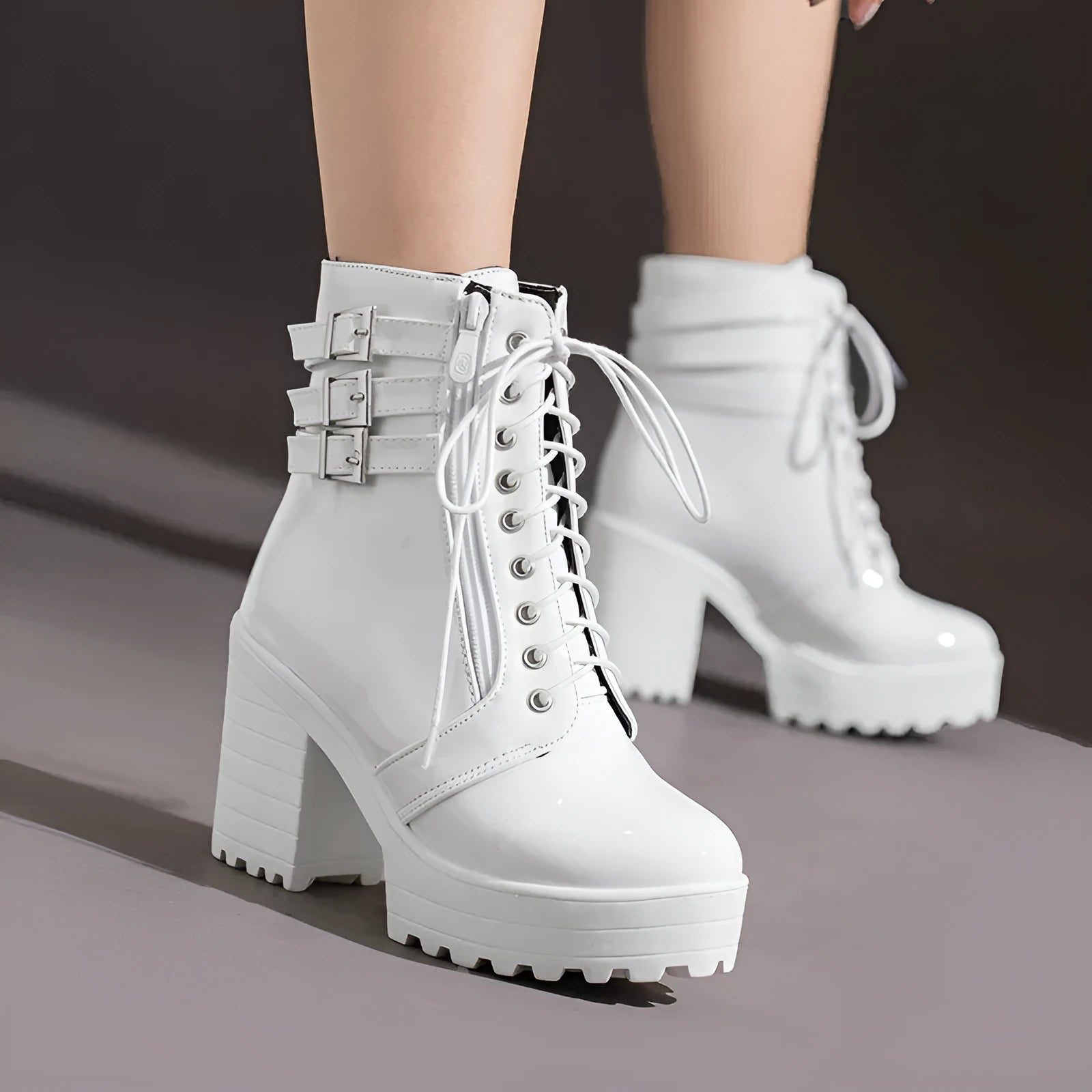 Women's black casual lace-up ankle boots with a chunky heel and thick rubber sole.