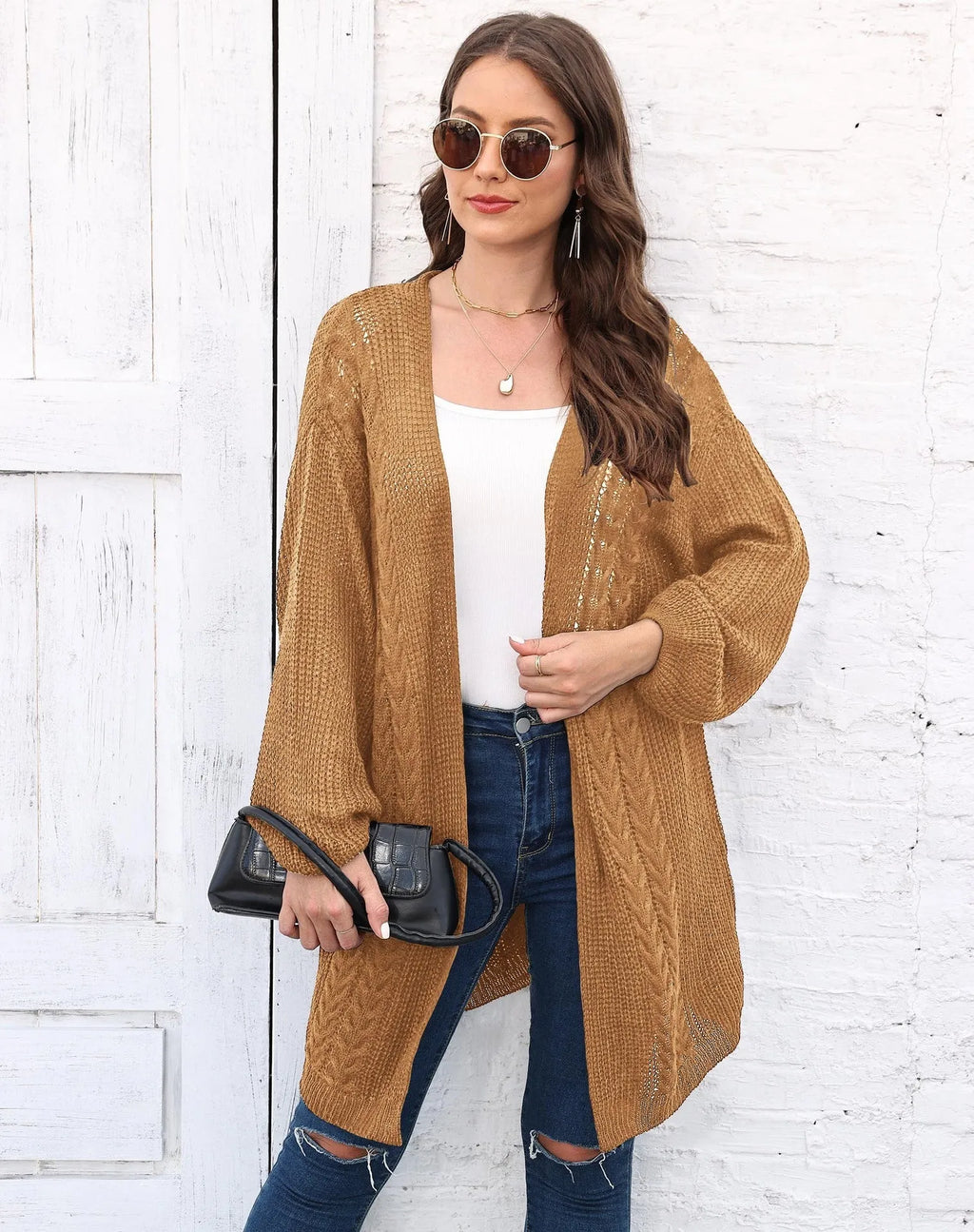 Women's loose-fit acrylic sweater coat in a solid colour, shown in light grey.