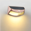 Solar garden wall lamp with retro smiling face design for outdoor decorative lighting