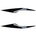 Two ABS plastic headlight eyebrow stickers for Ford Focus in carbon fibre and piano black finishes.