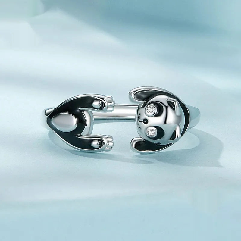 Adjustable sterling silver panda open ring with white gold plating on a finger