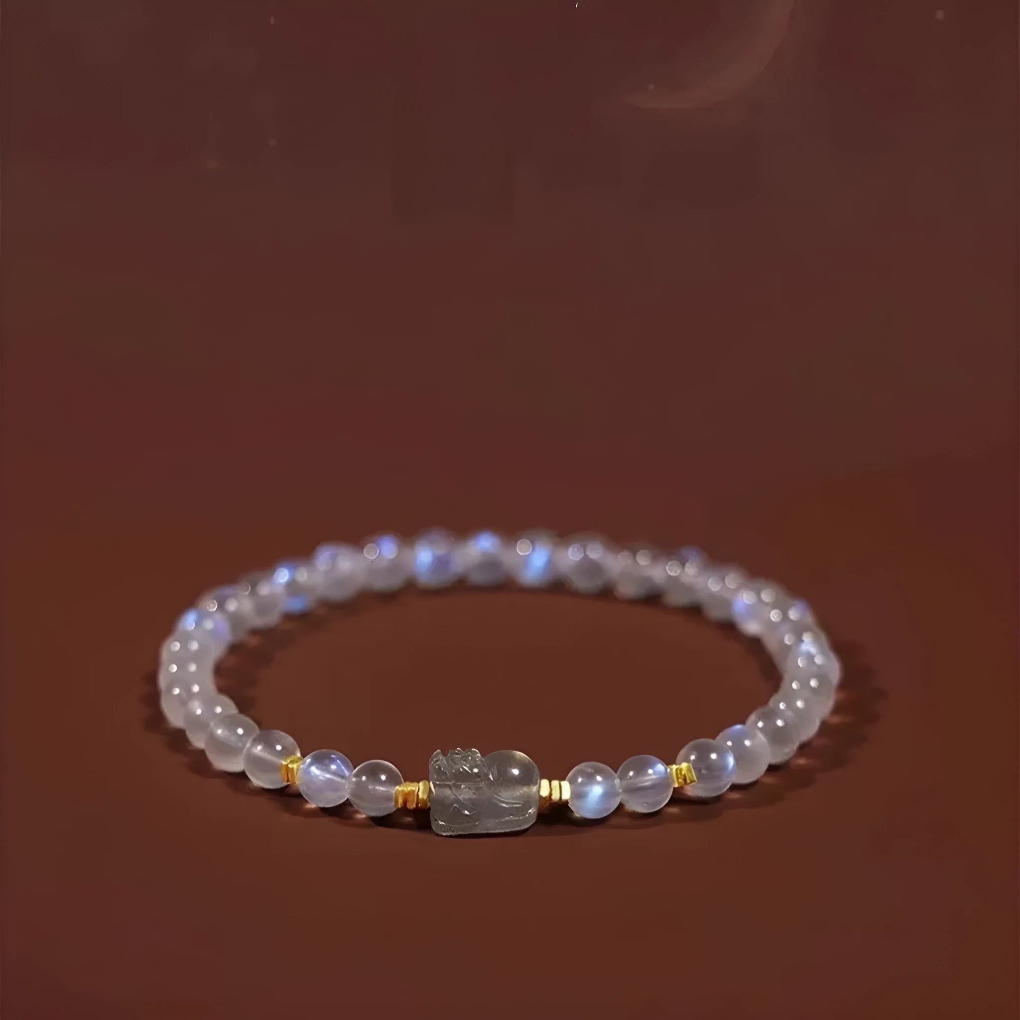 Moonstone bracelet with animal zodiac motif in national style design featuring blue light elements