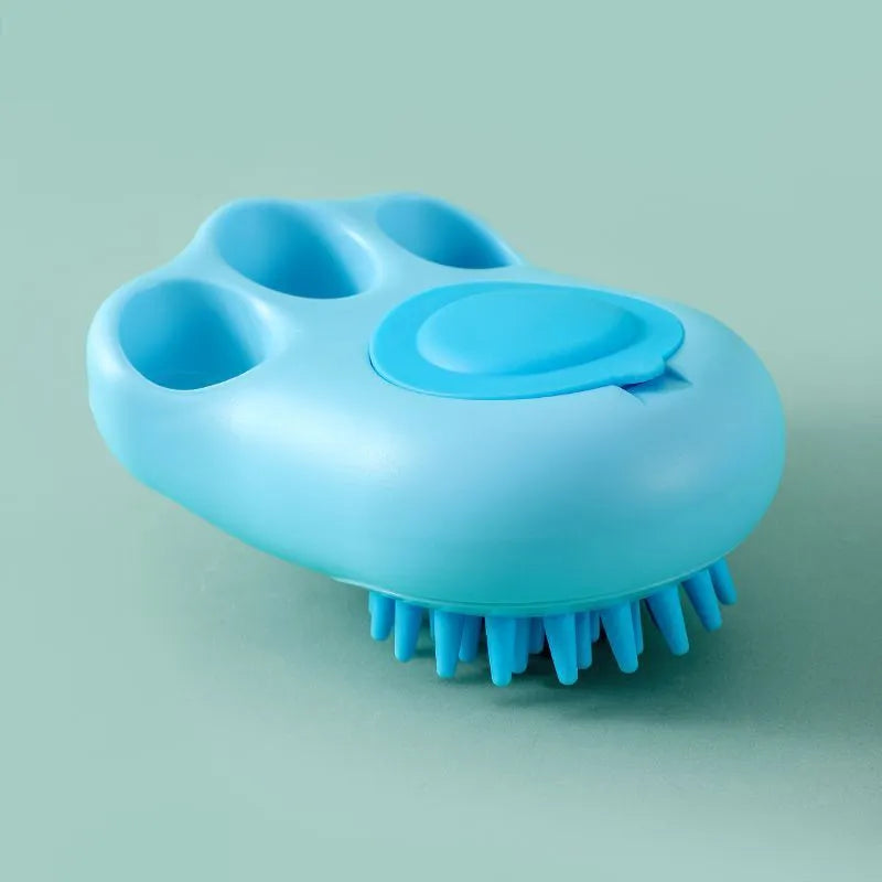 Blue silicone claw pet bath brush with non-slip handle for dog and cat grooming.