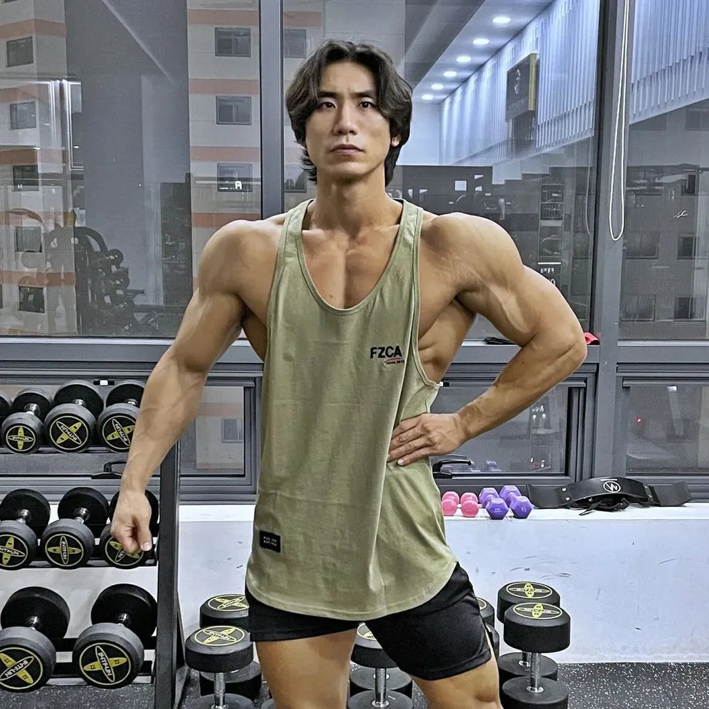 Men's white cotton fitness vest for summer running and gym training on a plain background