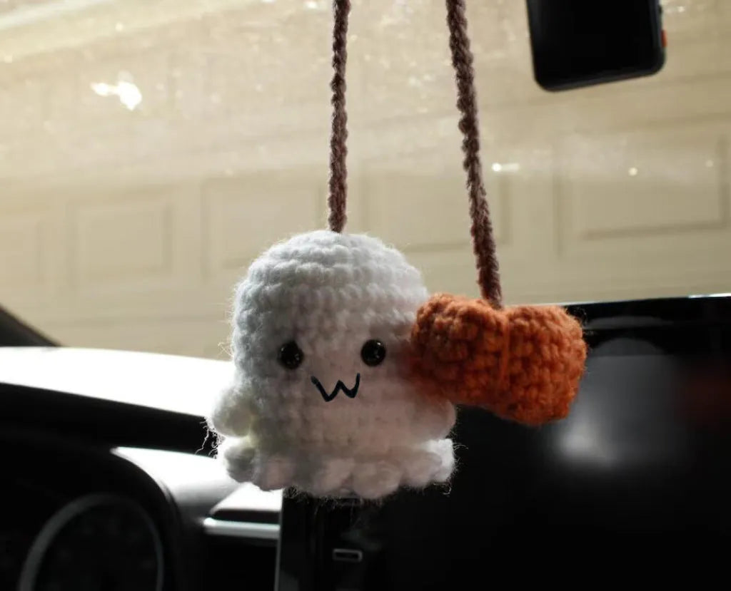 Plush hand-woven car hanging ornament showing various cartoon character designs including ghosts, bats, pumpkins, and monsters