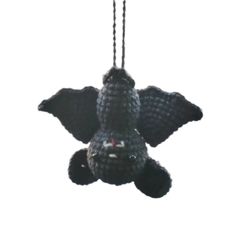 Plush hand-woven car hanging ornament showing various cartoon character designs including ghosts, bats, pumpkins, and monsters