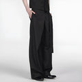 Black loose fit straight-leg trousers with single pleat front and adjustable waistband