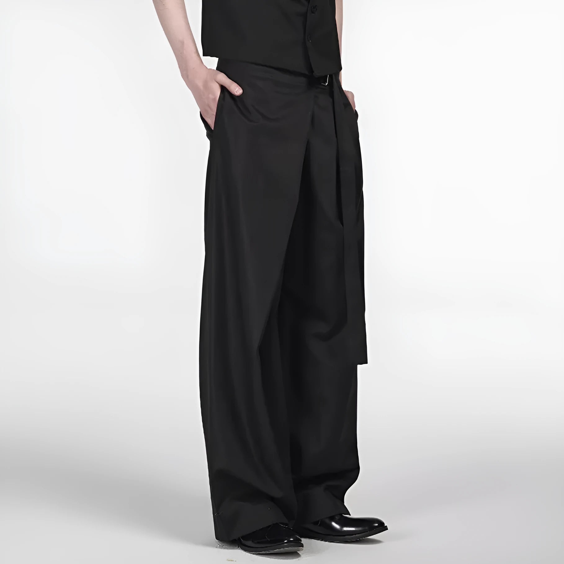 Black loose fit straight-leg trousers with single pleat front and adjustable waistband