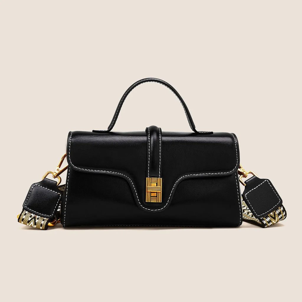Cambridge-style leather messenger bag in clamshell design with lock detail and internal compartments