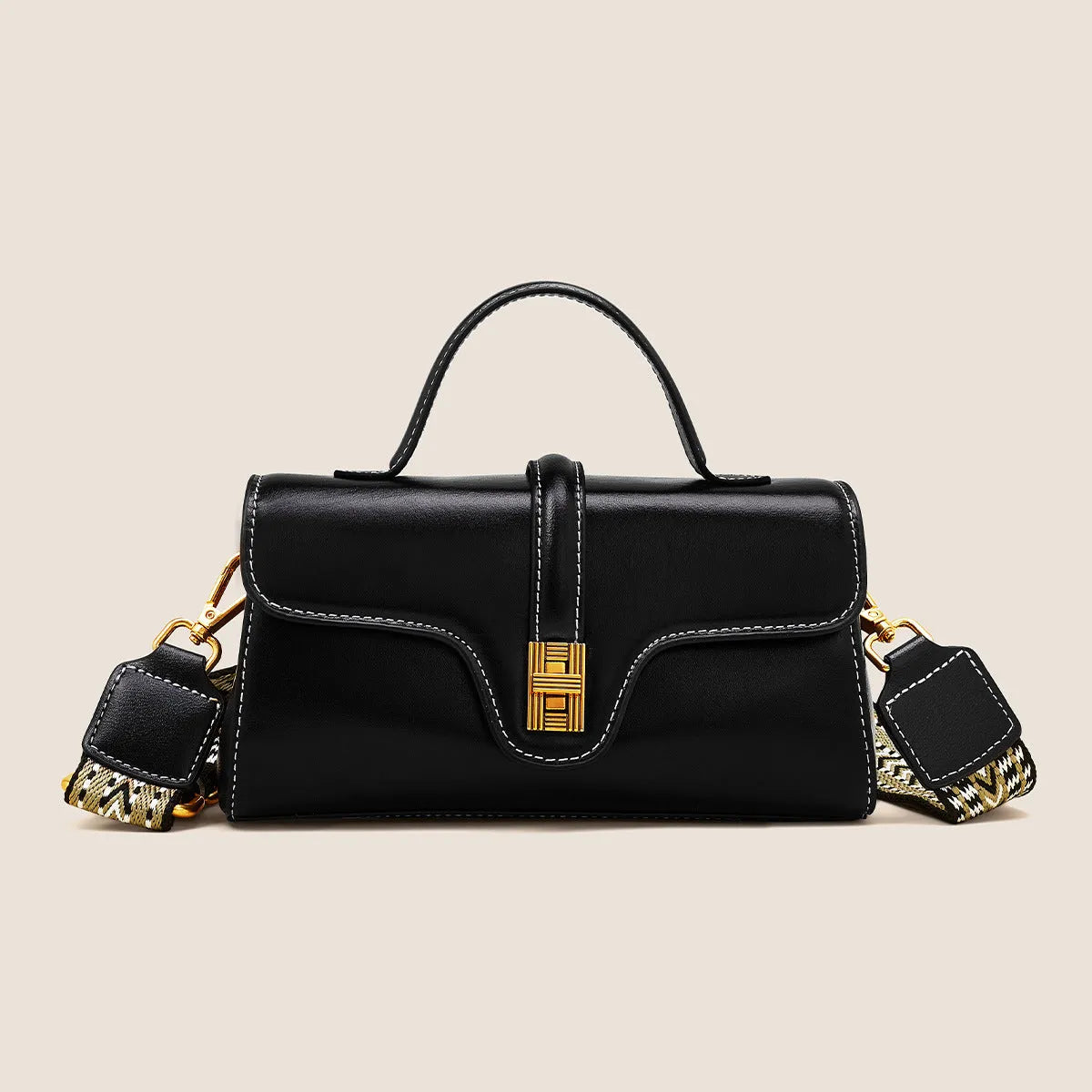 Cambridge-style leather messenger bag in clamshell design with lock detail and internal compartments