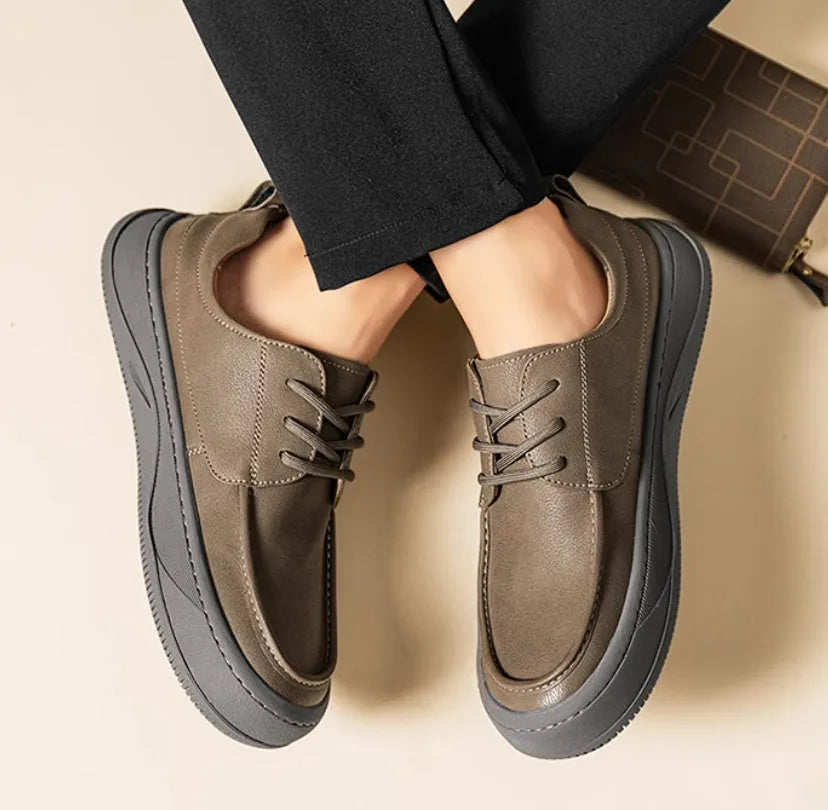 Brown leather retro casual shoes for men with a distinctive big toe design and visible stitching.