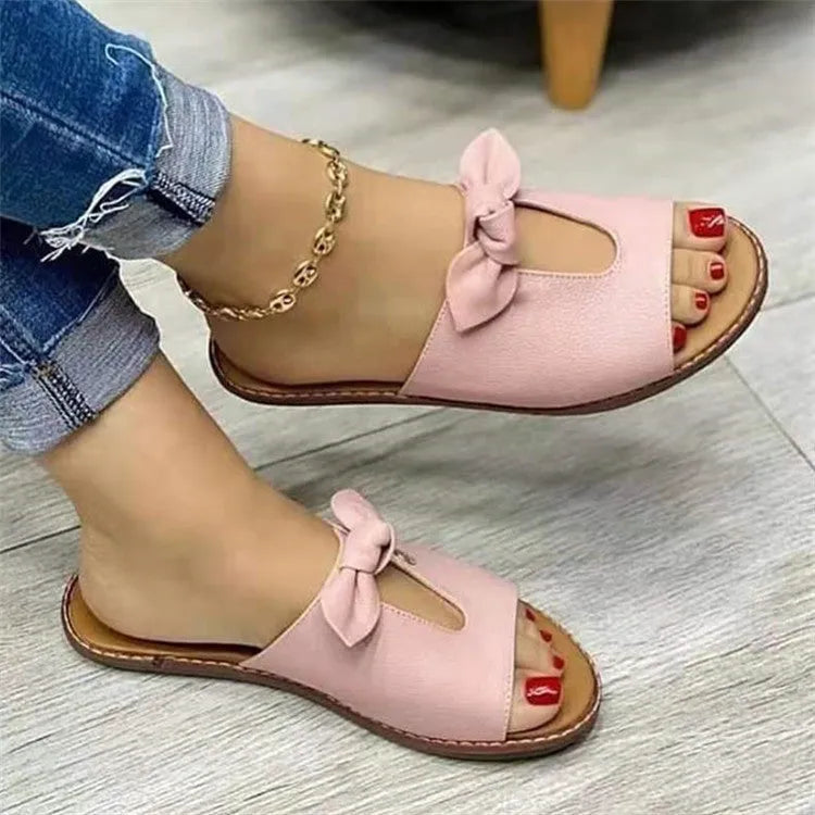 Ladies black fish mouth sandals with a bow detail on the synthetic PU upper.