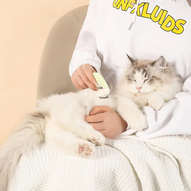 Blue dual-use pet comb with a built-in cleaning needle for removing dog and cat hair.