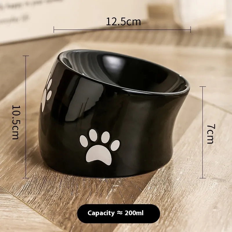 Ceramic cat bowl with high foot design and oblique mouth in cat's paw pattern