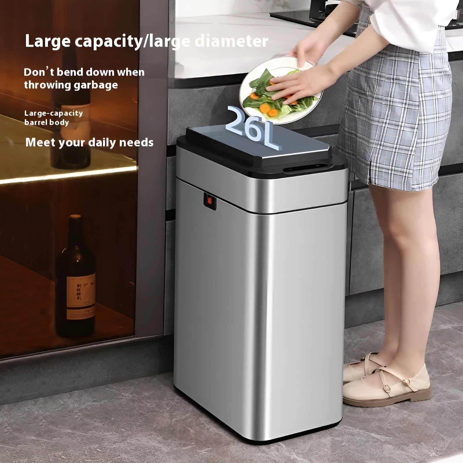 Stainless steel inductive smart trash can with square design on a kitchen floor.
