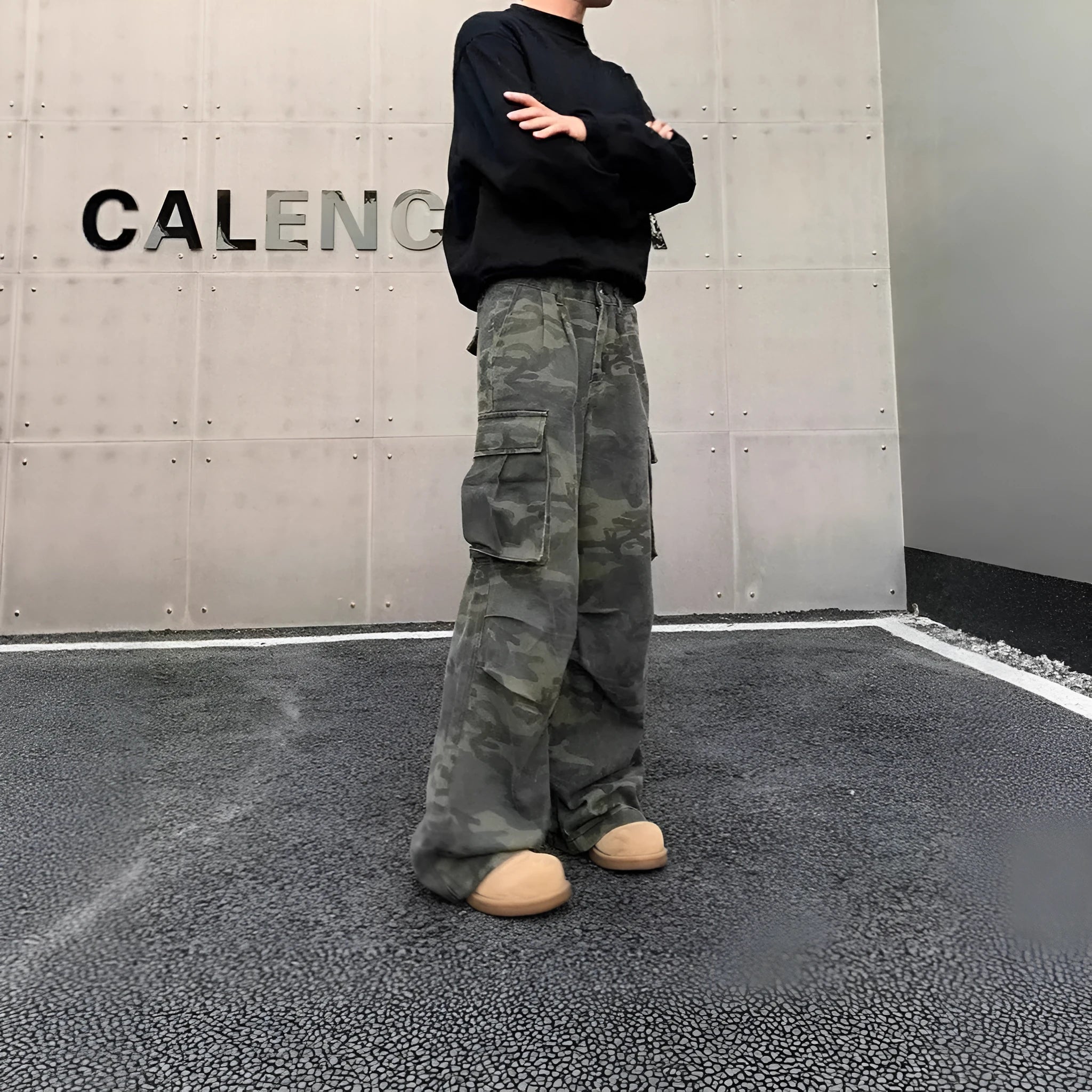 Korean style washed camouflage cargo trousers with multiple pockets on a mid-waist fit.