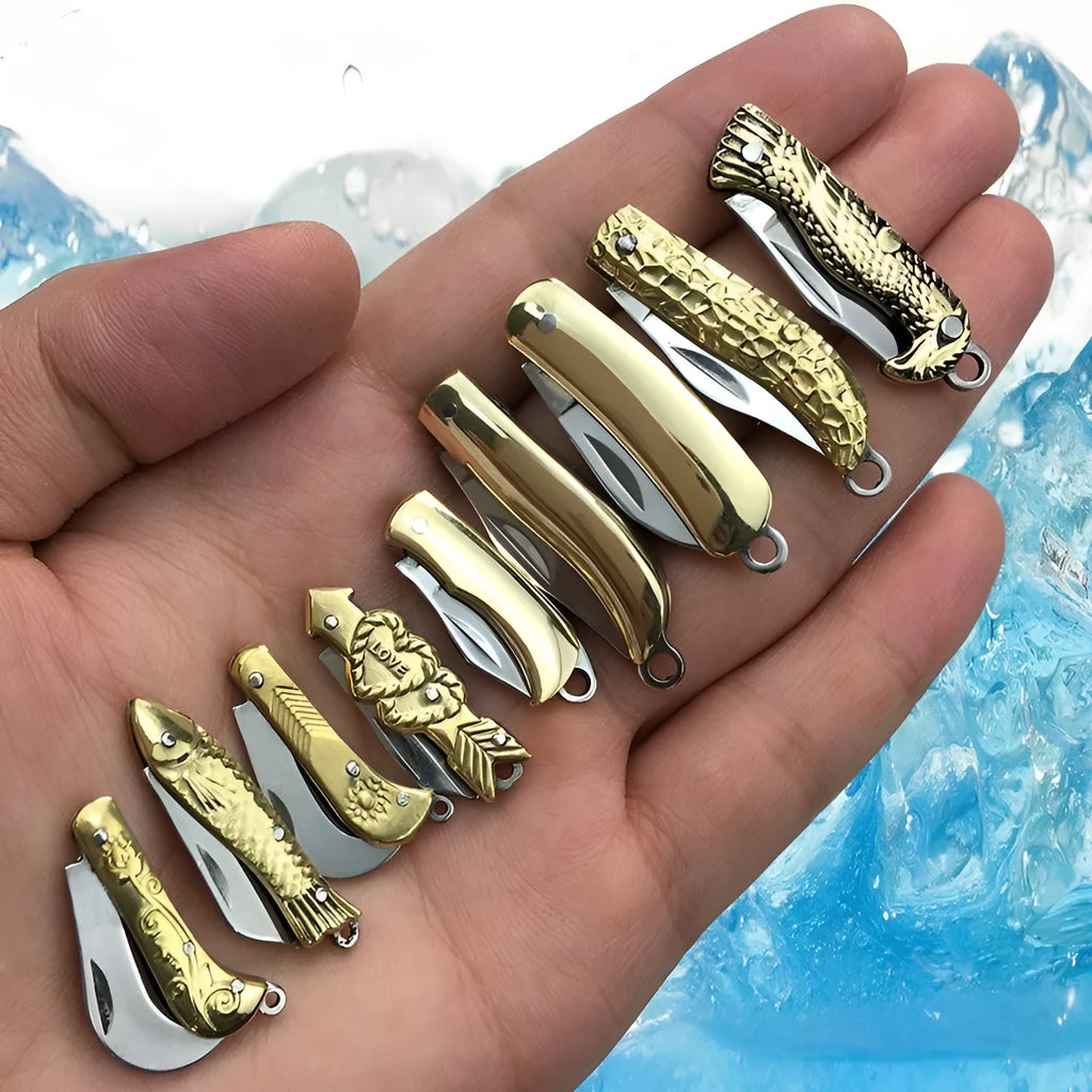 Brass mini folding knife keychain pendant with 3cm blade and 42mm shank on a key ring
