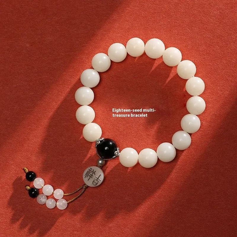 White jade Bodhi bracelet with round 10mm beads, ruyi decoration, shown in obsidian, red agate and red code brain colour variants