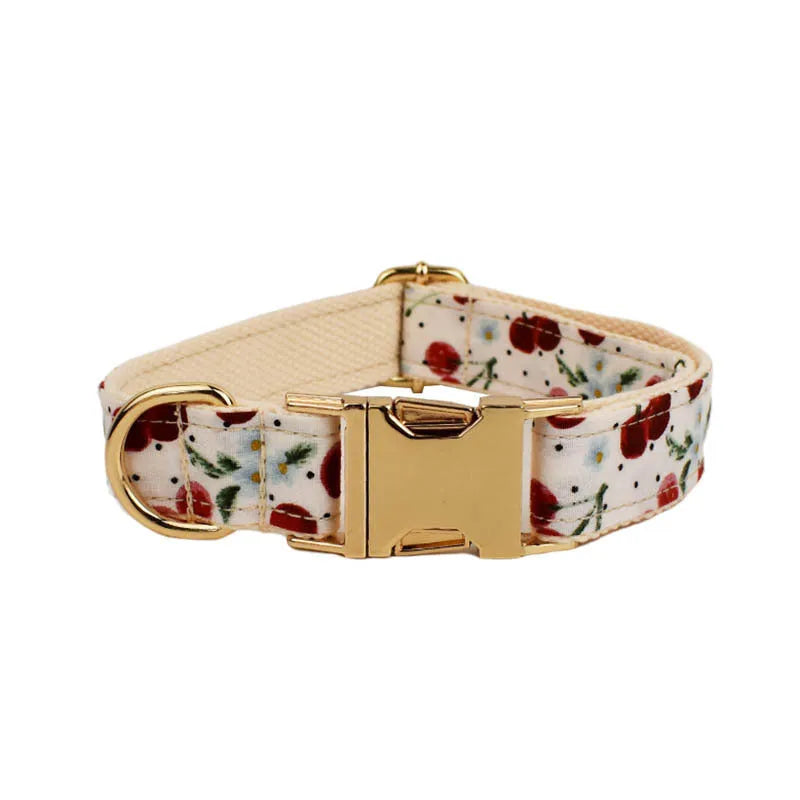 Red cherry printed cloth dog collar with light gold buckle and detachable bow strap