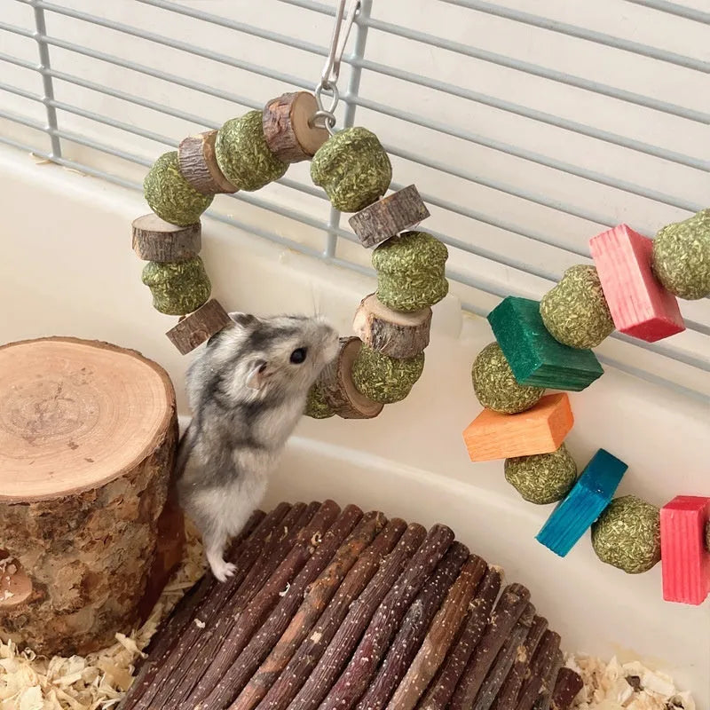 Hamster toy with Totoro-shaped rings, straw balls, and applewood molar rods for small pets