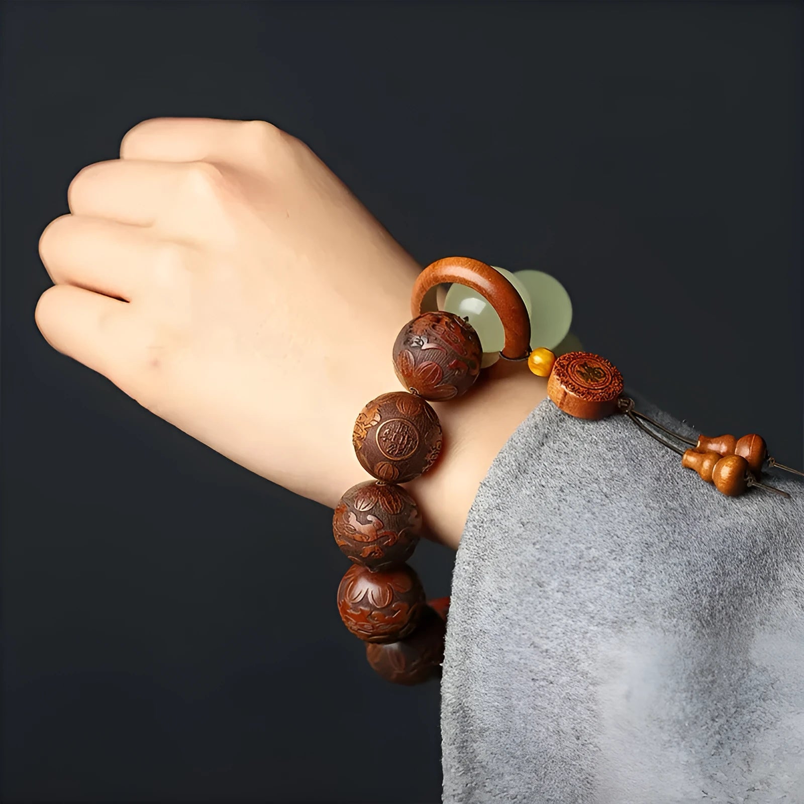Wooden amass fortunes bracelet with carved Fu character design on rosewood