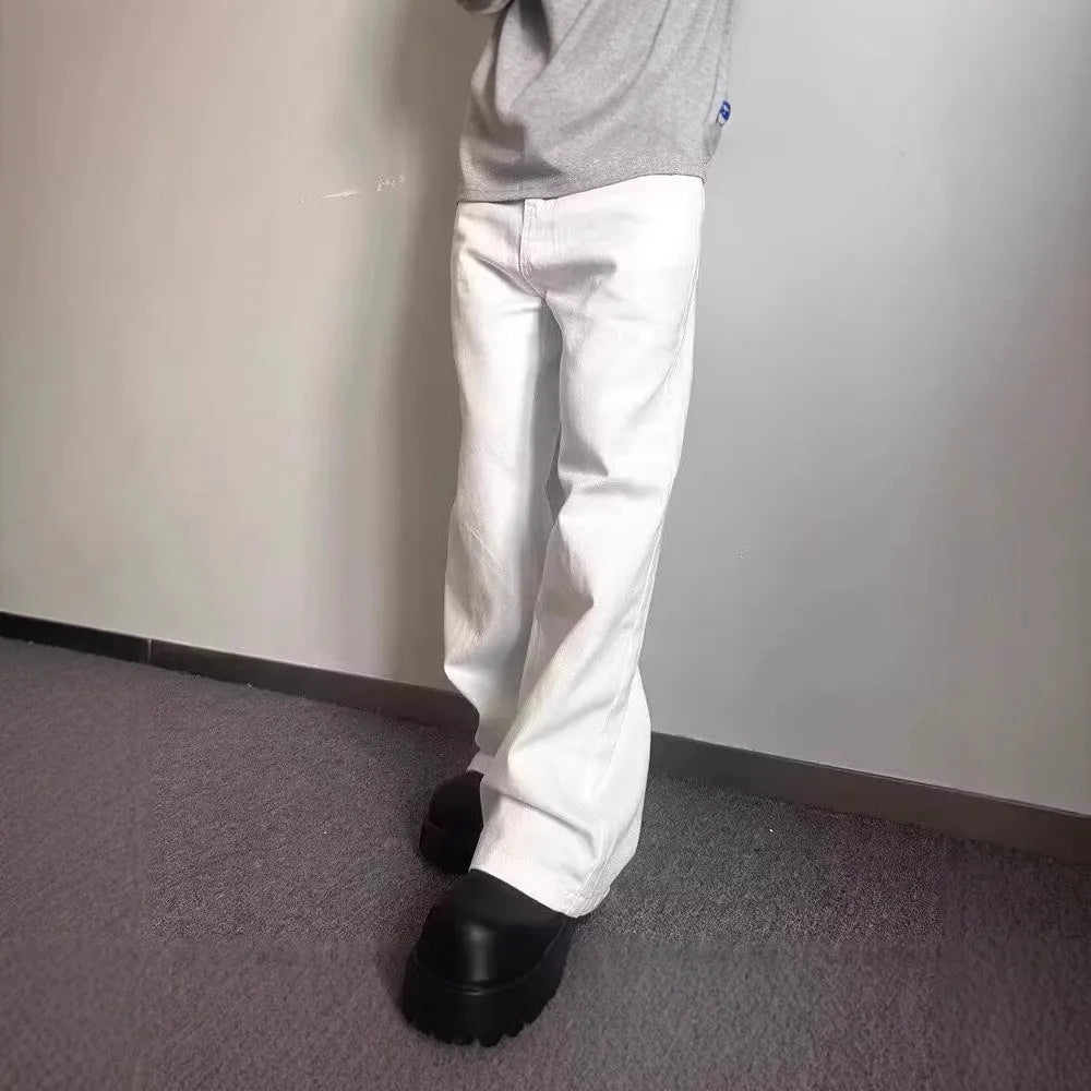 Men's straight leg white denim jeans with a mid waist and wide leg opening.