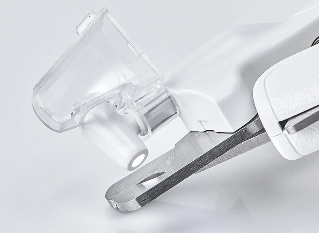 White pet nail clippers with LED light on the handle and a clear anti-splash guard covering the blades.