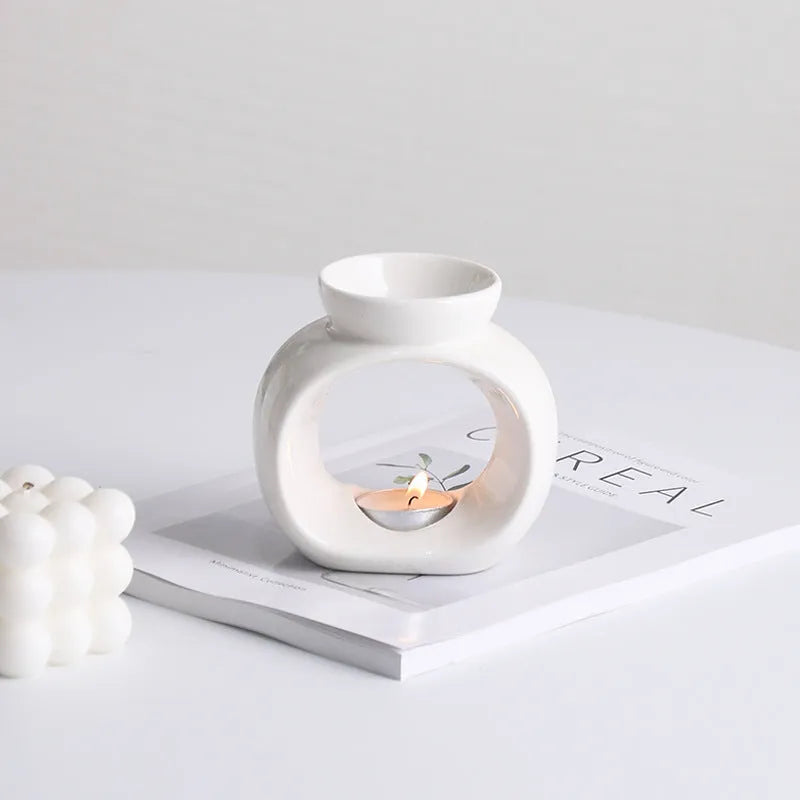 White Nordic style porcelain aromatherapy stove ornament on plain background