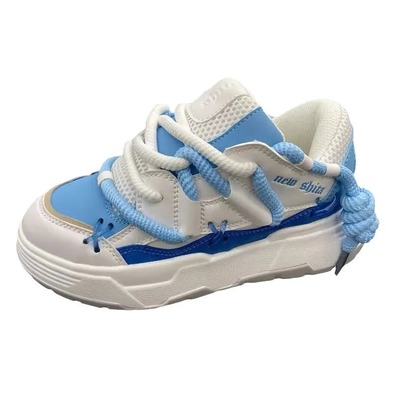 Women's thick sole grey retro sneakers with lace-up front and chunky rubber heel.