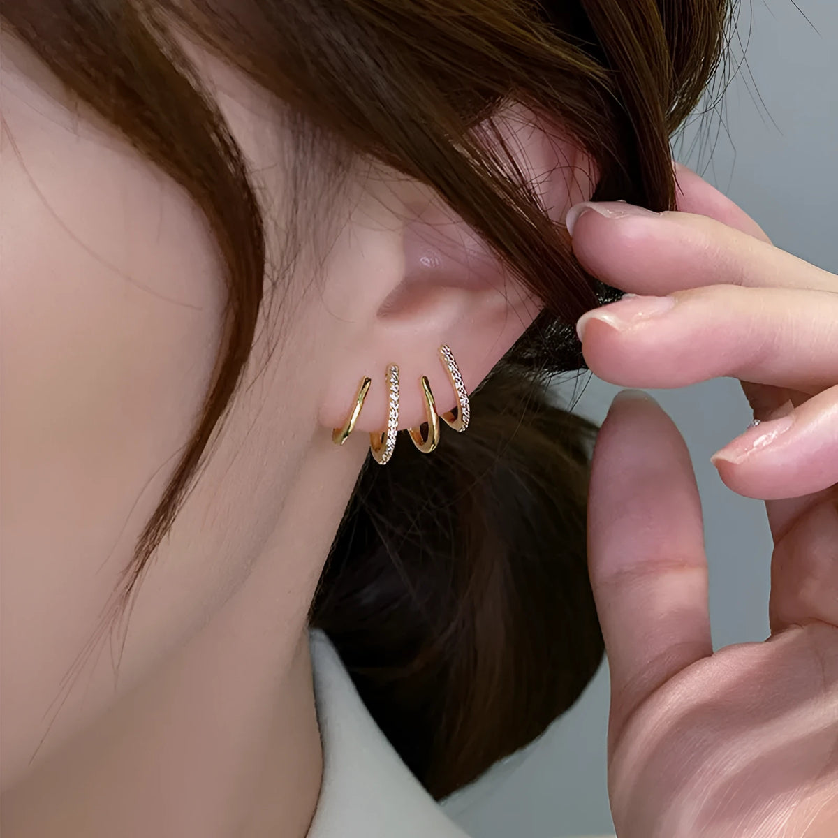 Pair of S925 silver needle four-prong zircon inlaid geometric stud earrings in gold finish