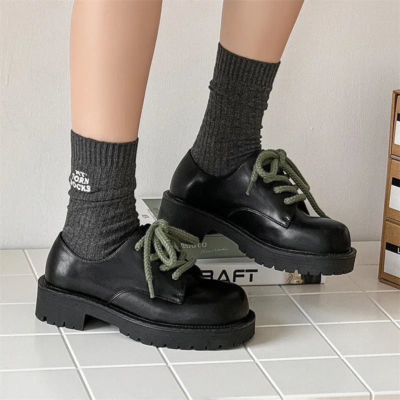 Big Head Derby men's and women's platform leather casual shoes with rubber sole on a neutral background.