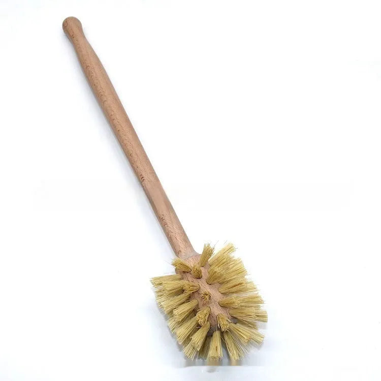 Large long handle cleaning brush with beech wood handle and natural sisal bristles on a wooden surface