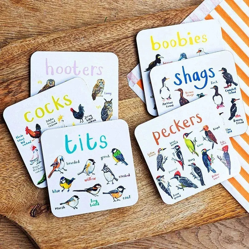 Set of six square PVC bird pun coasters with different bird chart designs on a table