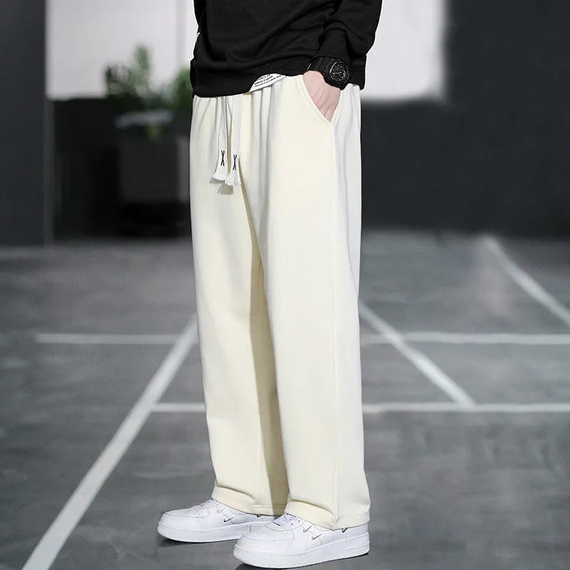 Men's grey casual bamboo fibre trousers with a high waist and multiple pockets.