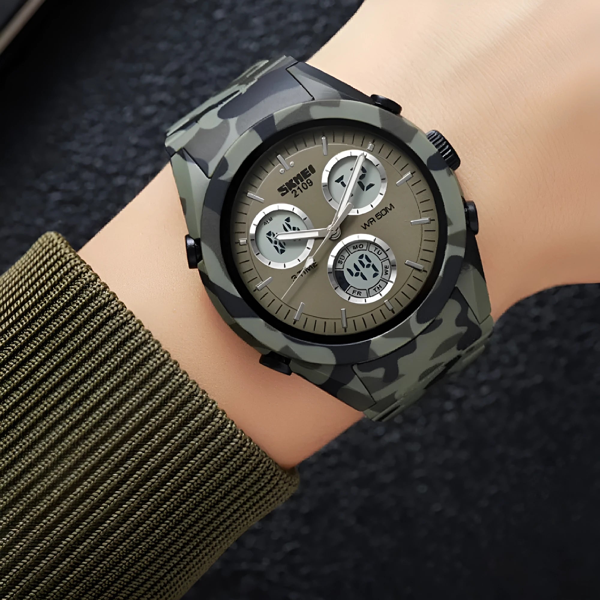 Unisex casual electronic watch with a camouflage TPU strap and resin face, showing 50m water resistance.