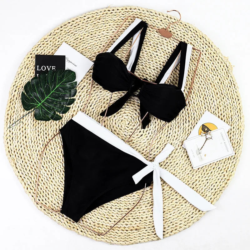 Black high-waisted two-piece bikini swimsuit set for women on a mannequin