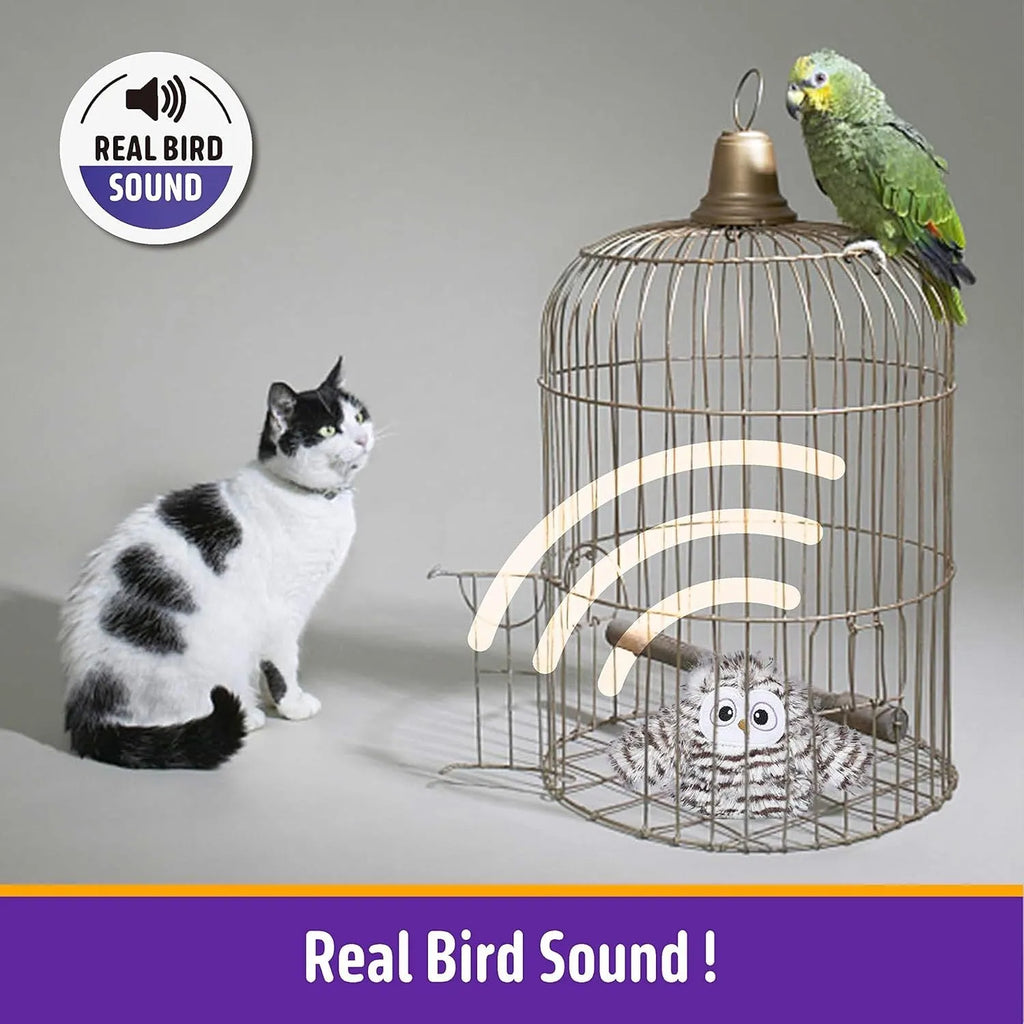 Grey automatic owl cat toy with flapping wings on a floor