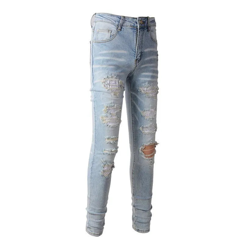 Light blue slim fit stretch men's jeans with distressed details and diamond patch pocket
