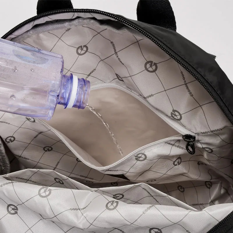 Large outdoor nylon backpack in black, shown with dimensions and sandwich pocket detail.