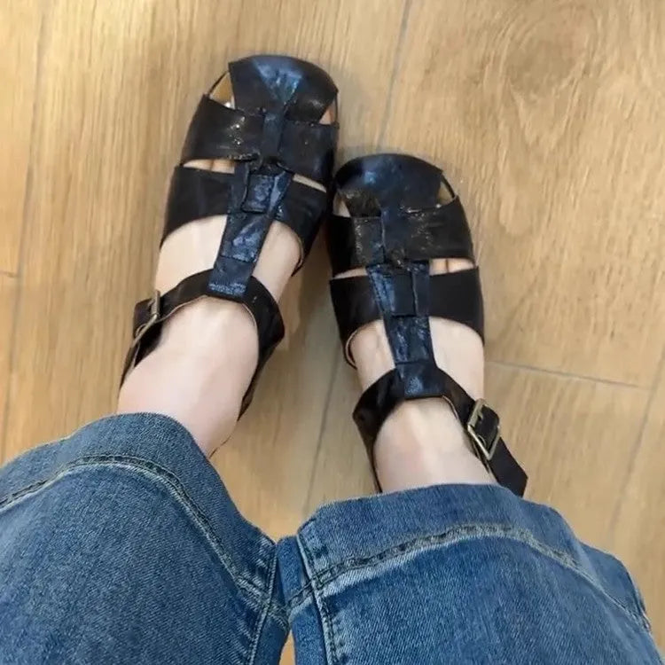Women's apricot buckle shoes with round toe, two-layer cowhide upper, and rubber sole on a plain background