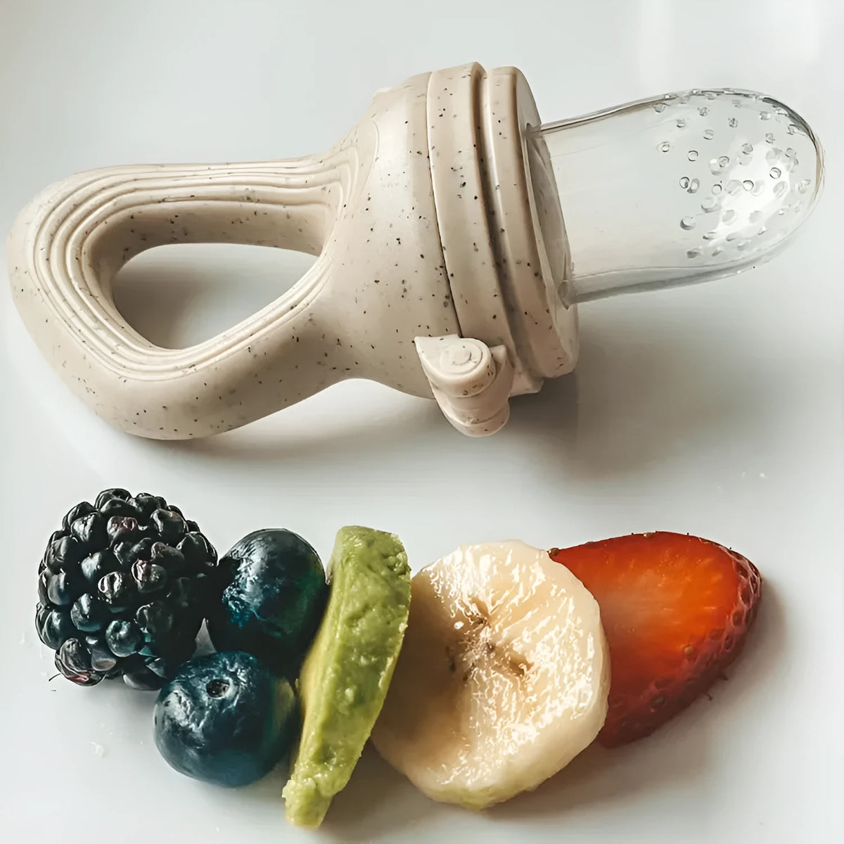Silicone baby fruit and vegetable teether with handle, round shape, medium-flow nipple, sizes S M L, colour options