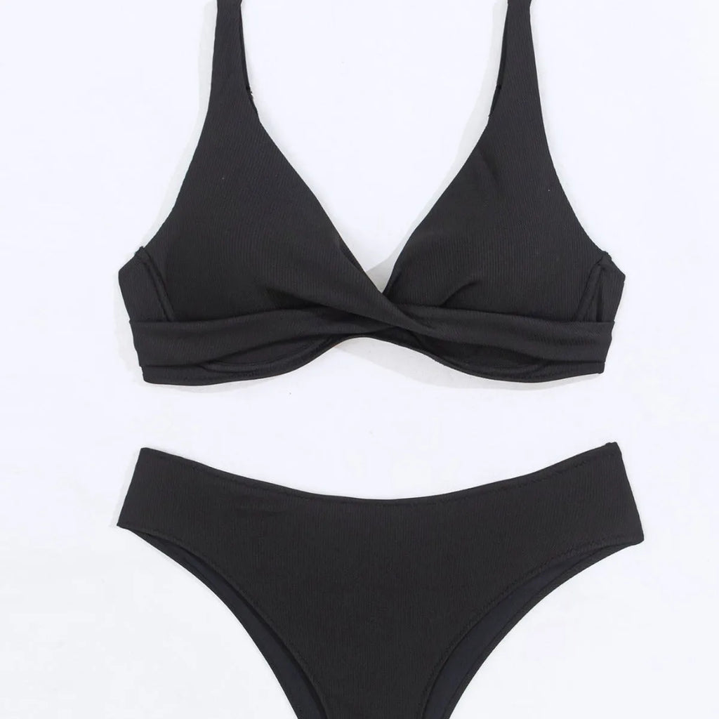 Women's black ribbed texture two-piece bikini set on a mannequin, showing briefs style.