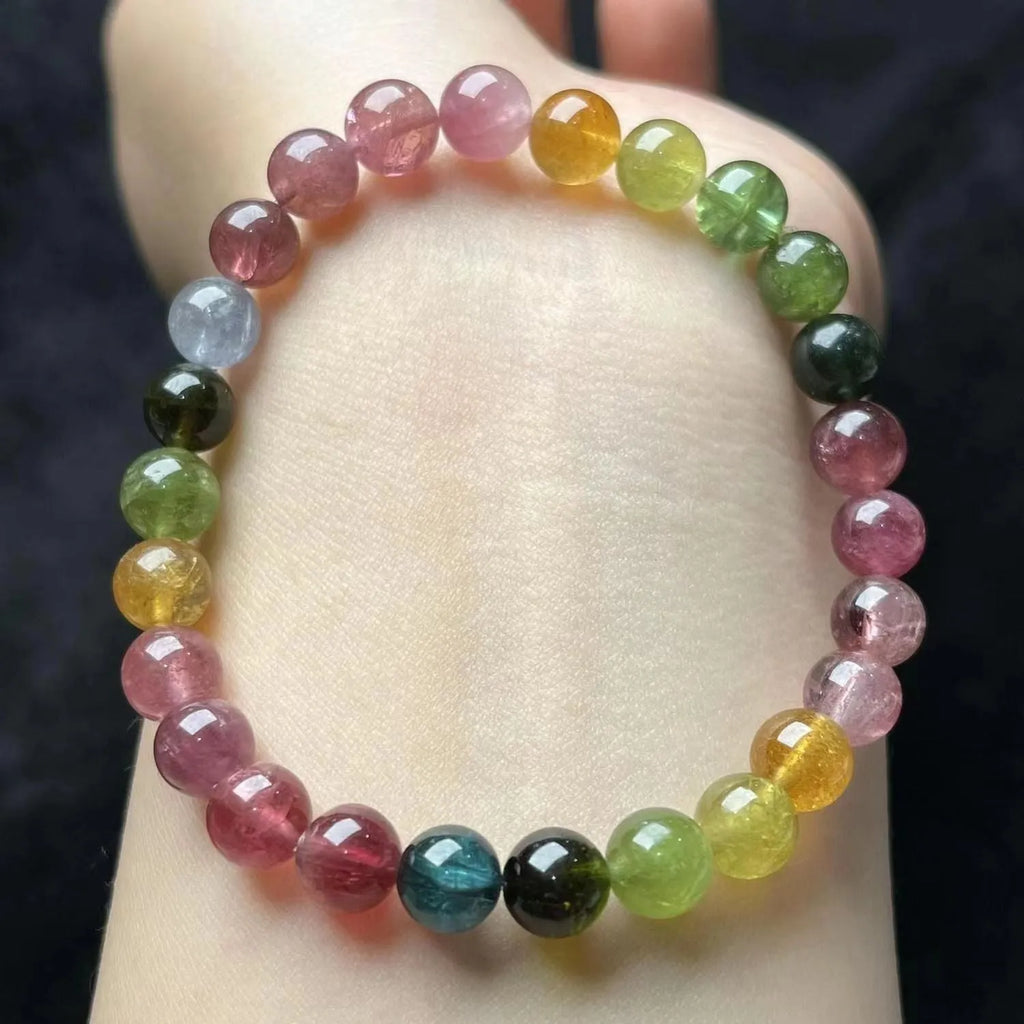Women's colourful tourmaline bracelet with four-leaf clover charm and pearl pendant on a mixed material electroplated chain.