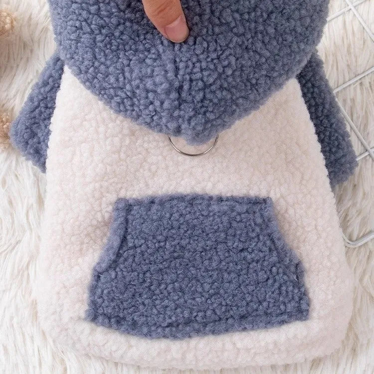 A blue hooded dog coat with thick cotton padding, shown on a model.