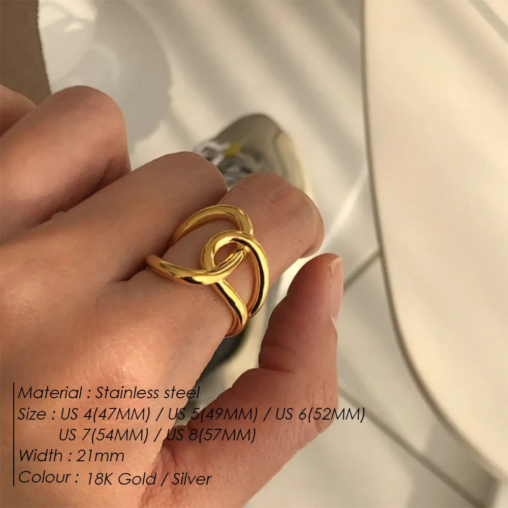 Adjustable knotted stainless steel ring for women in gold or steel colour, showing U-shaped geometric design.