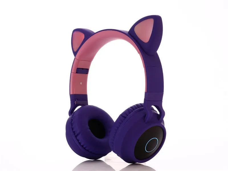 Pink cartoon-style wireless Bluetooth headset with cat ears on the headband, showing bilateral earcups.